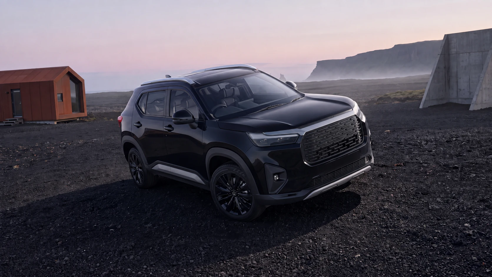 Black SUV seen from a raised front three-quarter angle on volcanic ground at dusk